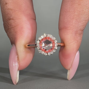 Halo diamond engagement ring with round rose cut centre stone.

