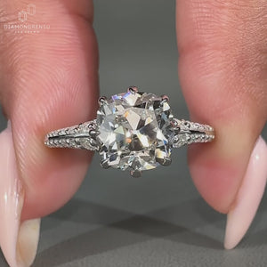 Two sided pave Cushion Old Mine Cut diamond ring.