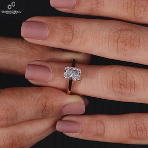 Solitaire engagement ring with peekaboo princess stone detail.
