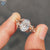 Nature inspired oval engagement ring enhances hidden halo ring details.
