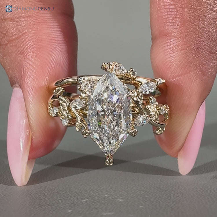 Dutch marquise bridal set with marquise and round side stones.
