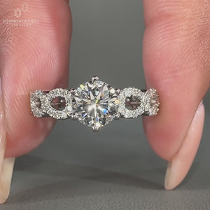 Twisted pave ring with prong setting.
