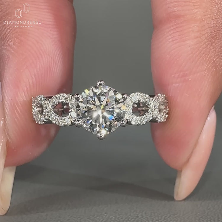 Twisted pave ring with prong setting.
