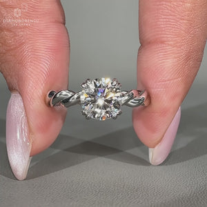 Round diamond engagement ring in white gold.
