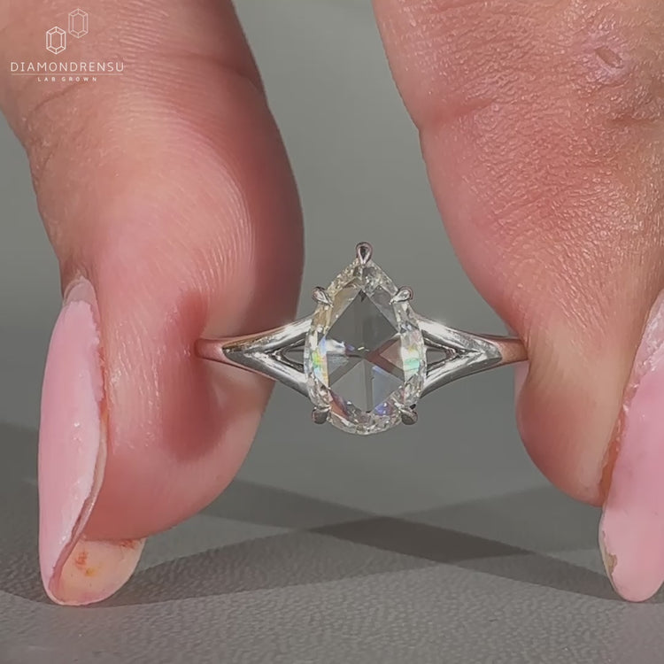 Solitaire diamond ring in split shank ring design.
