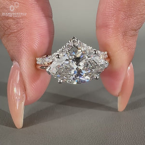 East west diamond ring with marquise cut and V shaped setting.
