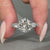 Round cut diamond ring with prong setting.
