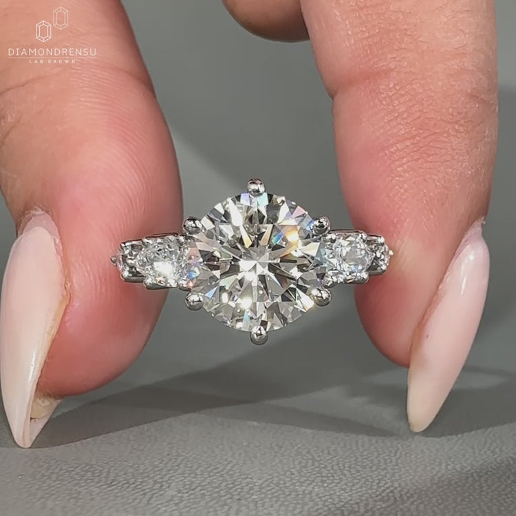 Round cut diamond ring with prong setting.
