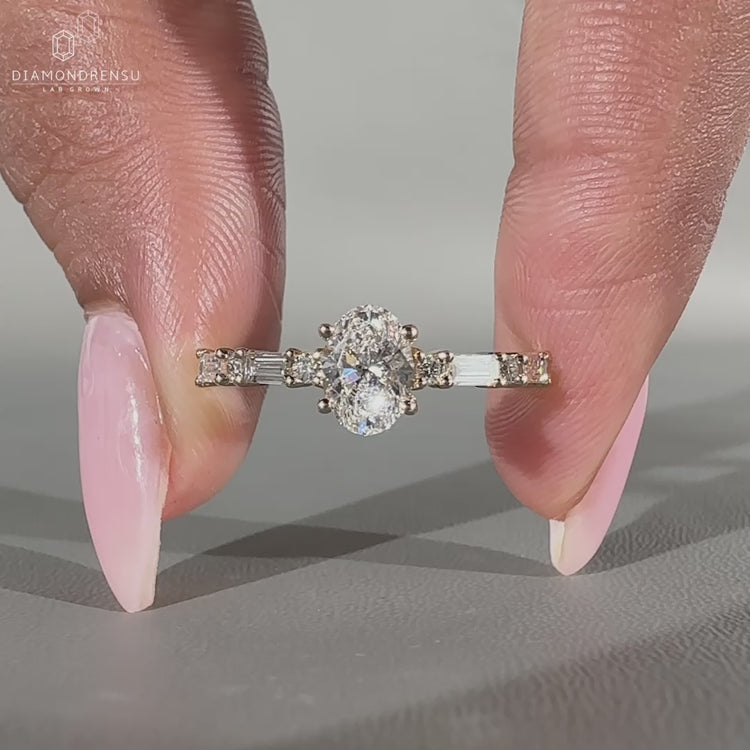 Yellow gold oval engagement ring with pavé setting.
