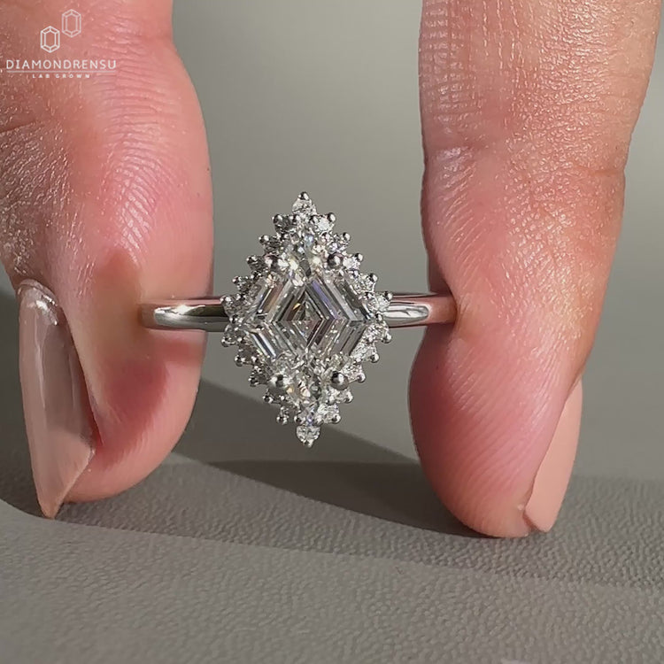 Round cut halo setting in white gold engagement ring.
