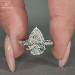 Handmade pear diamond ring in 3 claw prong design.
