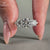 Round diamond engagement ring set in white gold engagement ring.
