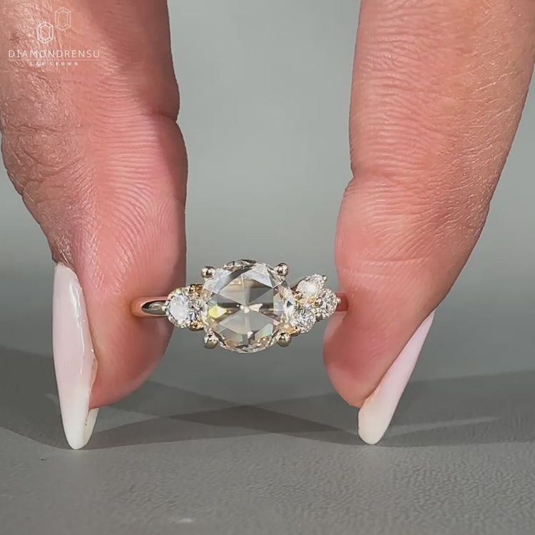 Marquise and round side stone with 4 prong setting.

