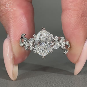 Nature inspired engagement ring with 6 leaf style prong.
