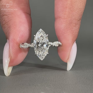 Twisted pavé band with round and marquise cut diamonds.
