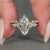 Marquise bridal set with seven stone ring design.