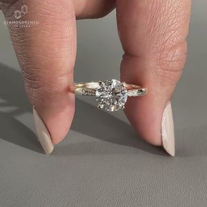 pinched shank engagement ring with tab prongs.
