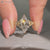 Marquise diamond ring with six claw prong setting.