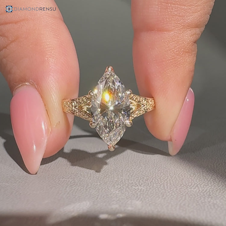 Marquise diamond ring with six claw prong setting.