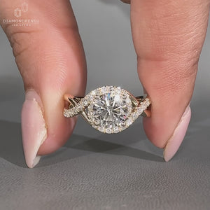 Round diamond ring halo style twisted shank setting.
