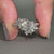 hexagon engagement ring in white gold setting.
