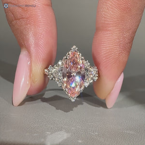 Pink marquise diamond ring with trillion side stones.