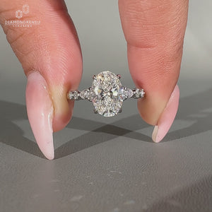 Oval diamond ring seven stone pear round side stones.
