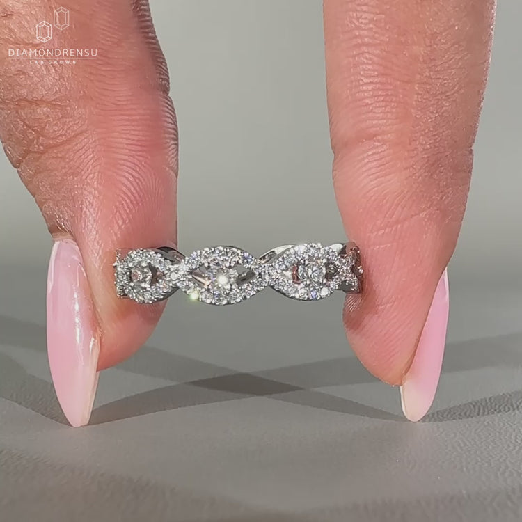 Round Cut Diamond Band in a twisted white gold design.
