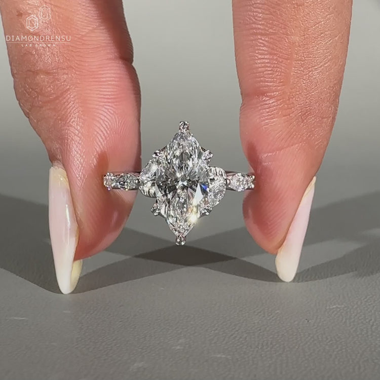 Handmade marquise cut diamond ring with pave band.
