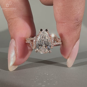 Pear diamond ring hidden halo double pave prong set.

