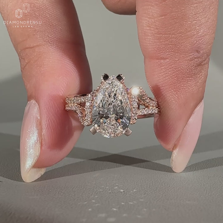 Pear diamond ring hidden halo double pave prong set.
