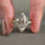 round marquise side stones on muse setting ring.
