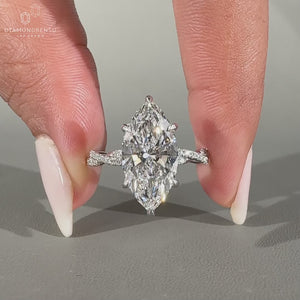Marquise Cut Diamond Ring in white gold with hidden halo.
