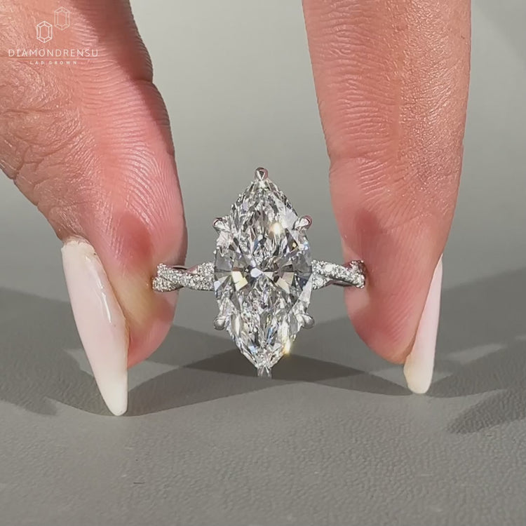 Marquise Cut Diamond Ring in white gold with hidden halo.
