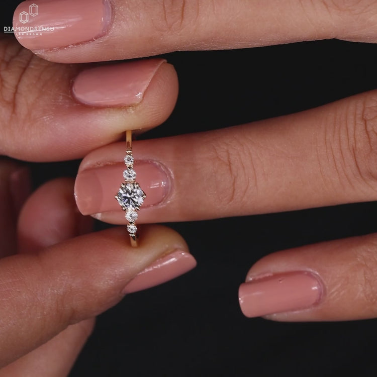 round diamond engagement ring with prong setting.
