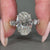 Pave band matched with 4 claw prong setting.
