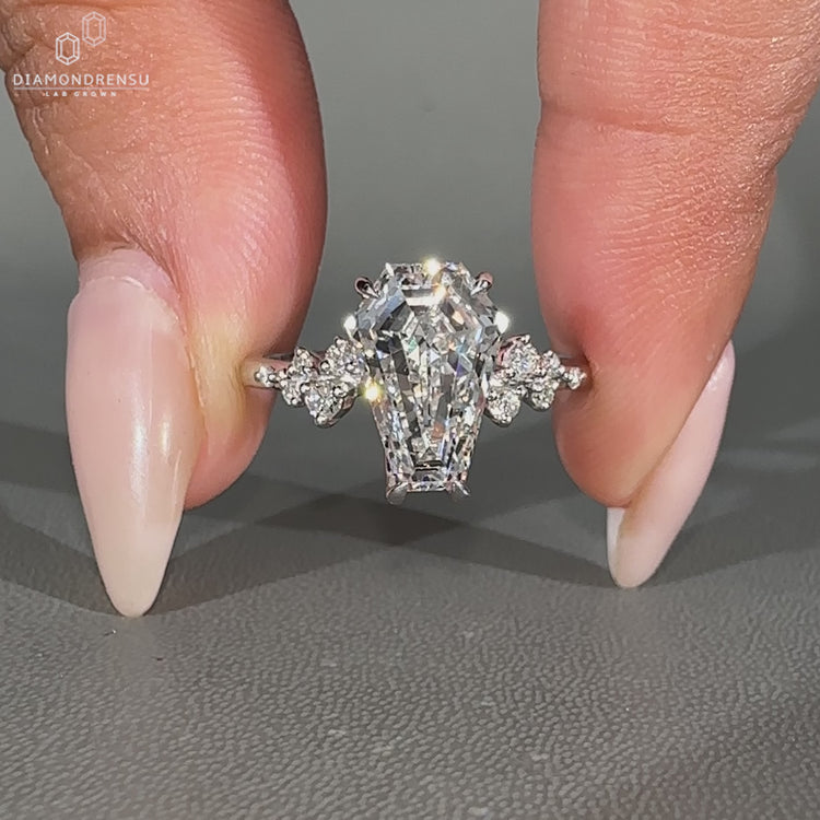 Coffin diamond ring cluster style prong setting.