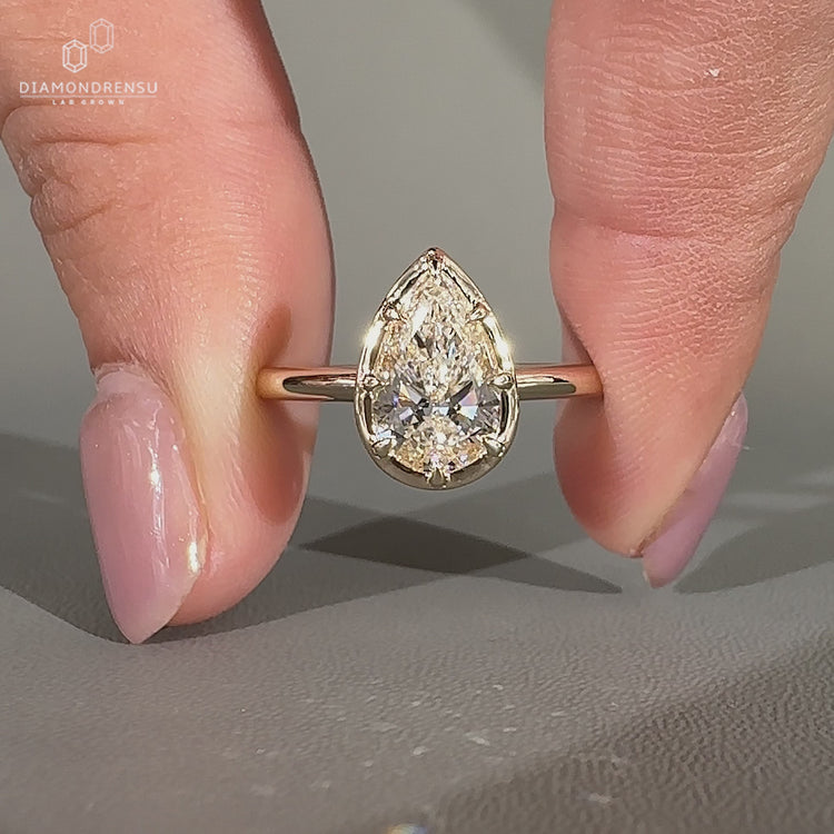 Pear diamond ring solitaire bezel prong vintage style.
