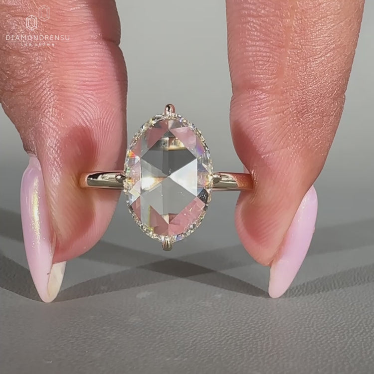 Oval rose diamond ring solitaire open gallery setting.
