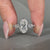 Handmade oval cut diamond ring in five stone style.
