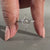 Lozenge cut engagement ring in white gold ring.
