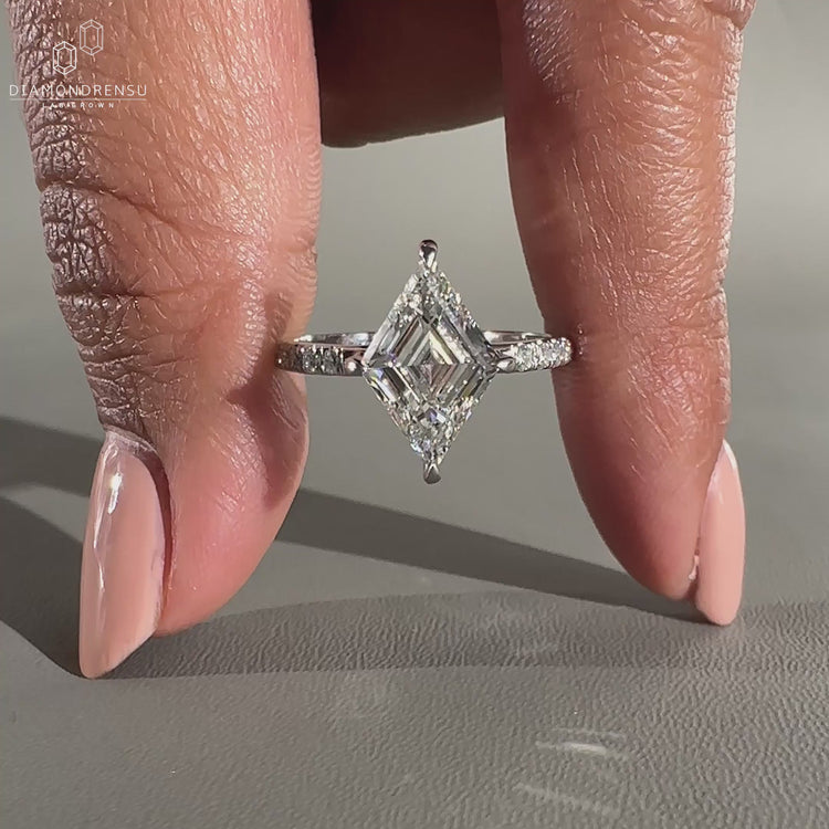 Lozenge cut engagement ring in white gold ring.

