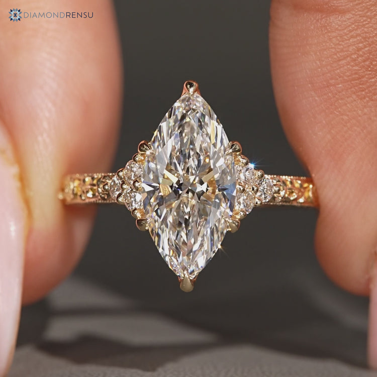 Marquise diamond ring with six claw prong setting.