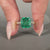 Asscher cut emerald ring cathedral milgrain prong set.
