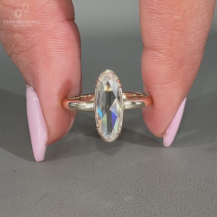 Moval rose diamond ring solitaire double claw setting.
