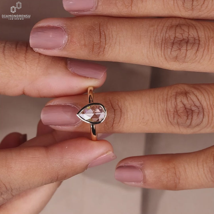 Handmade bezel engagement ring in yellow gold.
