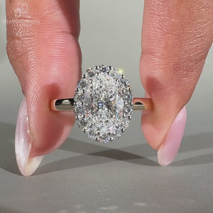 Round cut halo ring in white gold design.
