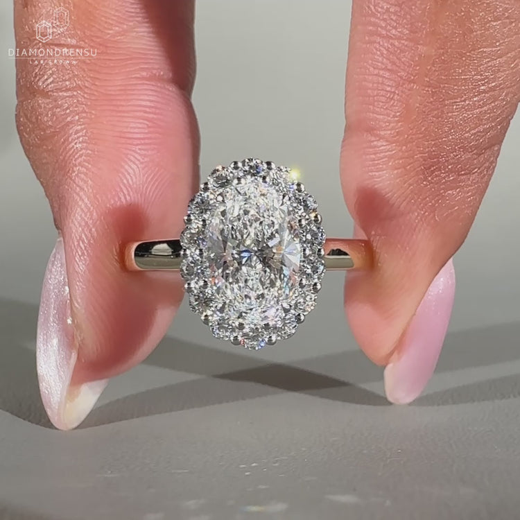 Round cut halo ring in white gold design.
