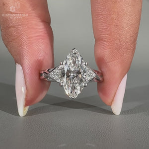 Handmade seven stone diamond ring with round side stones.
