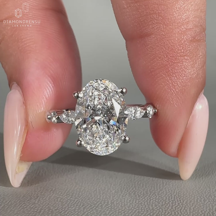 Marquise and round side stone with 4 prong setting.
